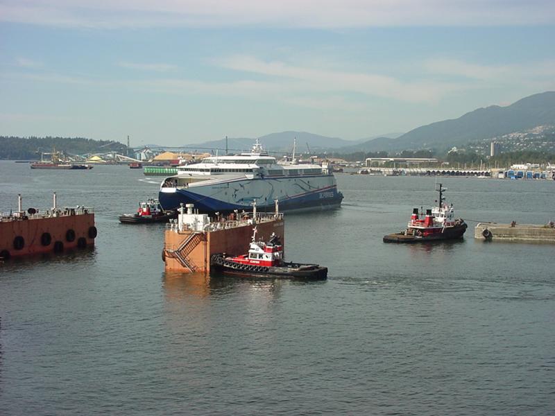 Dry dock is flooded and towed out to deep water.