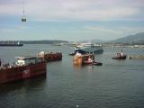 Tugs move in to position the vessel.