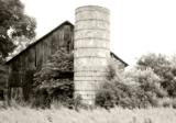 Silo on front of barn