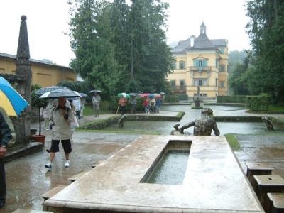 In the pouring rain at Hellbrunn palace waiting to watch the trick fountains
