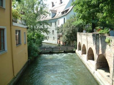 A canal in Augsburg; there is water in that little bridge across the larger canal