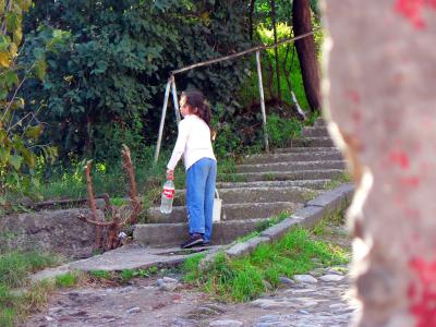 Girl carrying Water