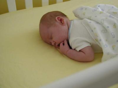snoozing in crib