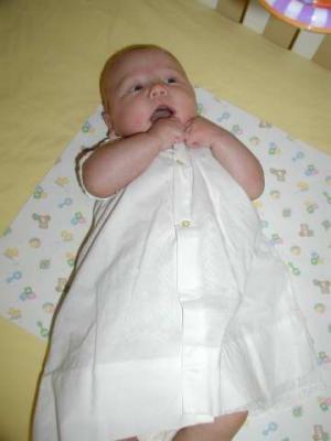 mommy puts on the gown to see if it fits