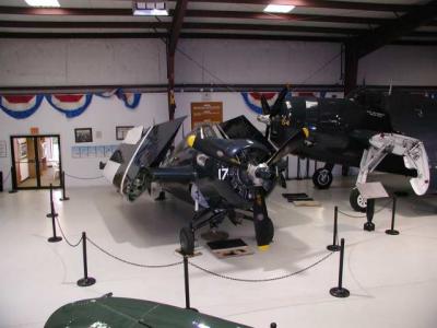 A Grunman F2 Wildcat Navy Fighter sits next to a Grunman Tom Avenger Torpedo/bomber