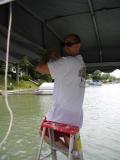 jeff putting on the boat hoist cover