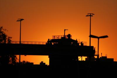 Sunset behind container crane