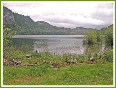 Horne Lake under a coludy sky.