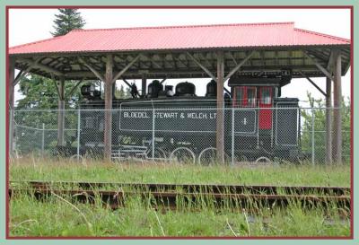 Retired logging locomotive on display.