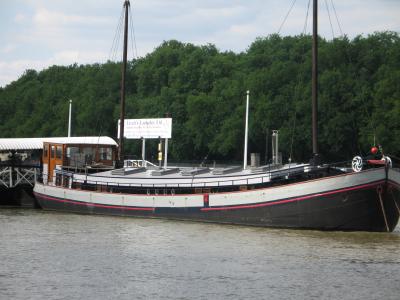 Large boat permanently moored on Putney Pier.