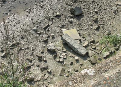 Block of granite thrown in river.