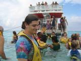 Austin having fun with our boat in the background