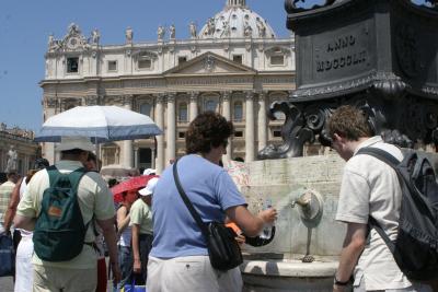 Jane filling her water bottle at a fountain in St. Peter's square-yes you can drink the water!
