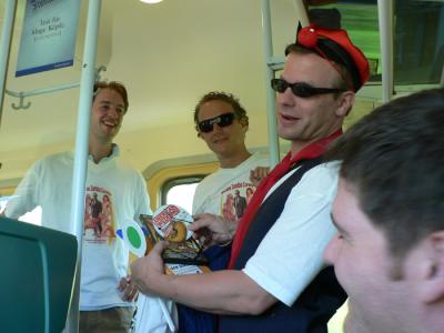 Bachelor party on the train - cute actually, this guys buddies were making him sell random things to get drinking money.