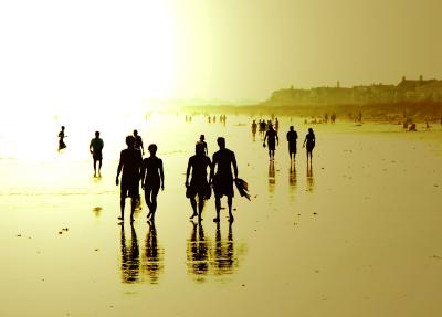 Beach goers at sunset on Isle of Palms