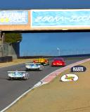 Porsche RS Spyder passing a Porsche 911 GT3 RSR, with two Audis in tow