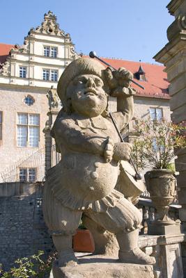 Statues of common folk in the garden of Schloss Weikersheim