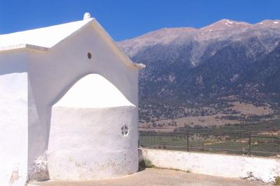 White chapel against white mountains