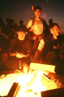 Mr. Curiel and Mr. Stroman in the glow of the campfire