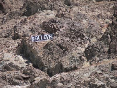 Sea Level sign up in the rocks