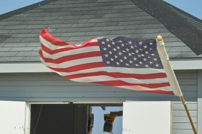 Flag on the only concession stand on the beach