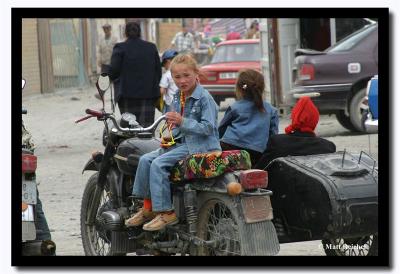 Russian Girl on a Motorcycle at Olgii's Bazaar
