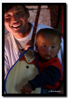 Father with Son Playing the Dombra, Bayan-Olgii Aimag