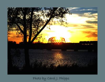 Sunset Train above Ohio River.JPG