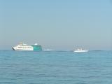 Nixe2 and the Espalmador ferry off Es Cavall
