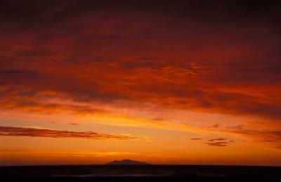 Day 11: Red morning sky seen from a beach near Bastia