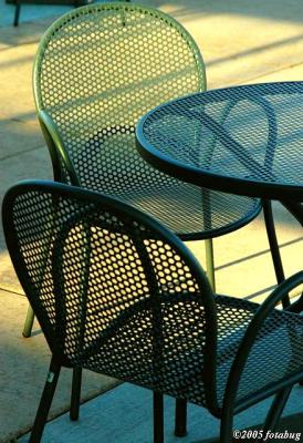 Chairs on sunlit deck