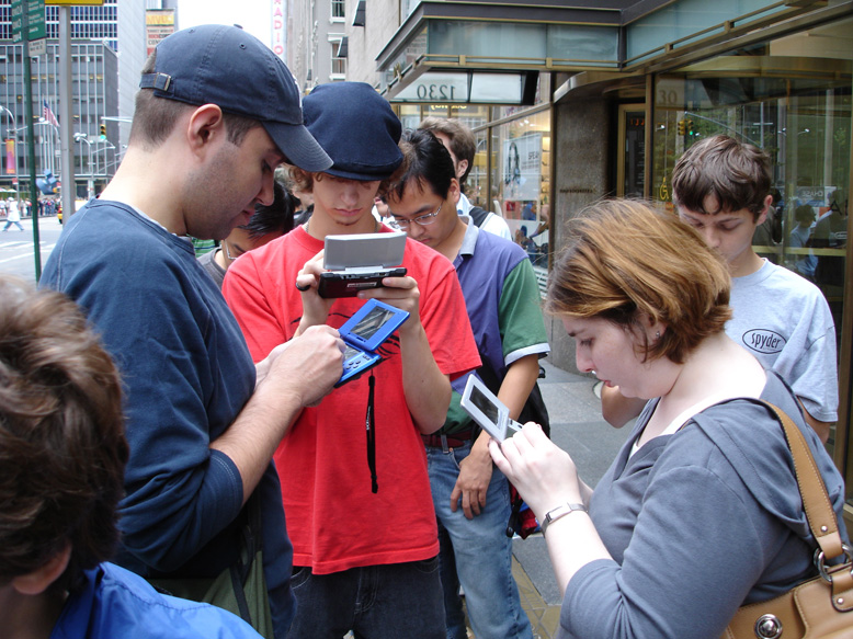 Group of Nintendo fans playing with their Nintendo DS