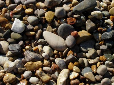 Pebbles on the beach. Lots of different colors.
