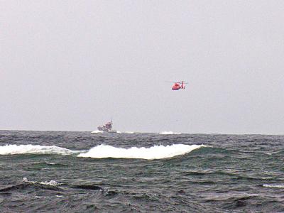 Coast Guard checking out boat.