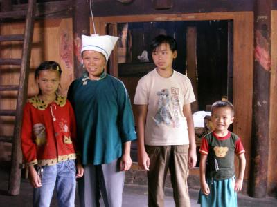 China: Family in their home at Shijidizhiqiguan.jpg