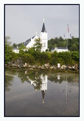 Day 6: We head into Boothbay for dinner after a rainstorm...Church reflected in puddle.