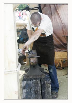 showcasing old time skills; (Blacksmithing)