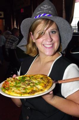 Abby serving a Bavarian pizza