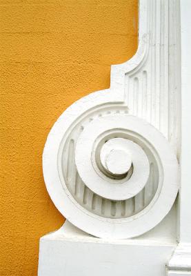 White spiral in yellow wall