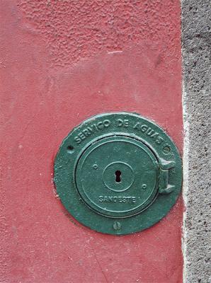 Green water service in red wall
