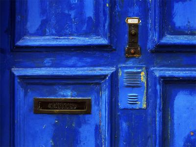 The blue door with the ring and letter box