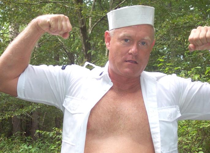 navy manly husband flexing biceps