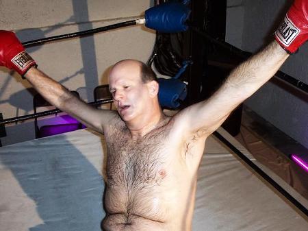 gay boxing daddy knocked onto floor ropes