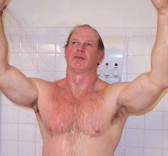 daddy bear showering rinsing off after beach