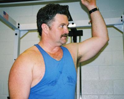 dad showing big chest muscles.jpg