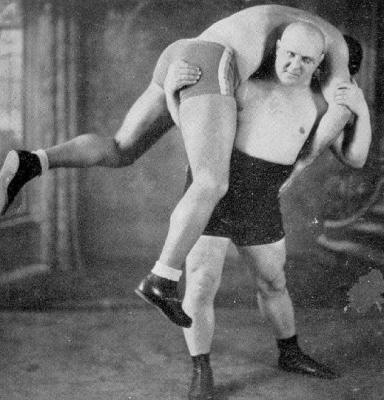 classic vintage pro wrestling carrying man