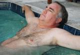 big daddy bear photos lounging in pool