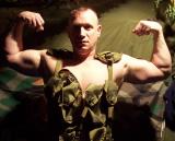 army man flexing big biceps