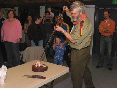 RA and one of the founding members Neil cuts the cake