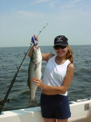 7/18/05 Clint Long Charter - Julie making a great catch on another 28 Striper